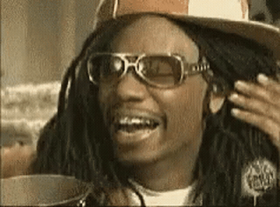 Man With Dreadlocks Smiling In Hat And Sunglasses GIF
