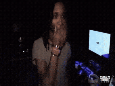 Man With Dreadlocks Smoking Cigarette In Front Of Sonden Comms Screen GIF