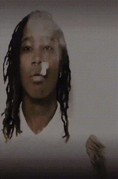Man With Dreadlocks Smoking Cigarette GIF
