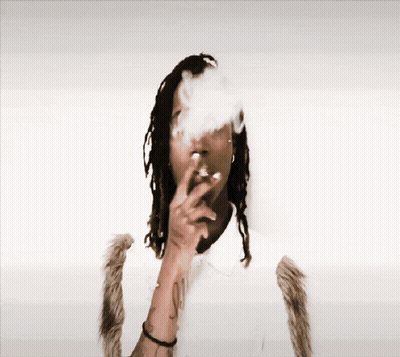 Man With Dreadlocks Smoking Cigarette Smoke From Nose GIF