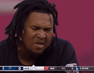 Man With Dreadlocks Watching Baseball GIF