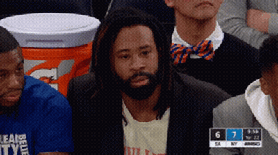 Man With Dreadlocks Watching Game In Stands GIF