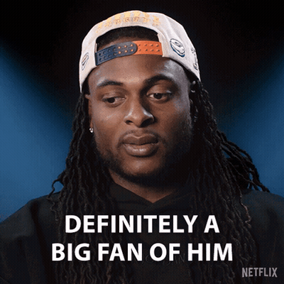 Man With Dreadlocks Wearing Fan Hat GIF