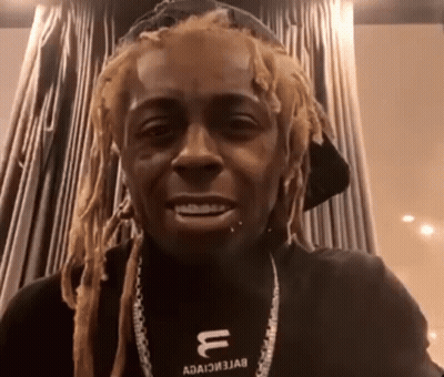 Man With Dreadlocks Wearing Hat And Necklace With Letter U GIF