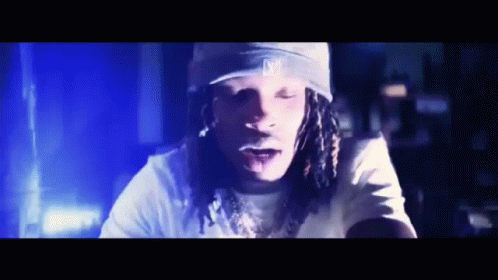 Man With Dreadlocks Wearing La Hat GIF