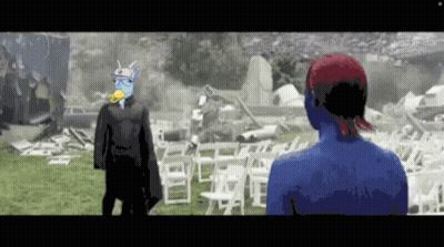 Man With Duck on Head Next to Woman With Blue Body