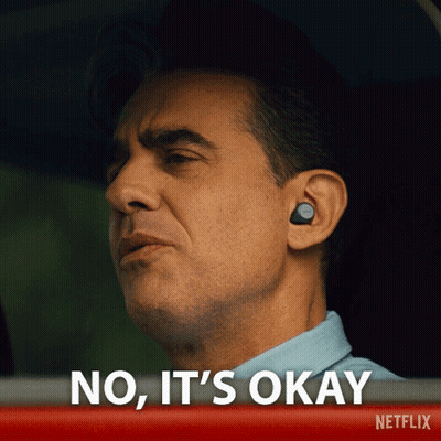 Man With Ear Buds Saying No It's Okay In Netflix Ad GIF