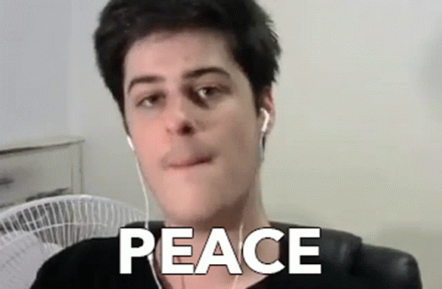 Man With Ear Buds Saying Peace GIF