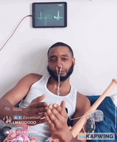 Man With Earbuds Holding Baseball Bat In Front Of Tablet Showing Heartbeat GIF