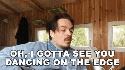 Man With Earbuds Saying Oh I Gotta See You Dancing On The Edge GIF