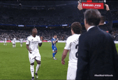 Man With Emirates Sign On Soccer Field GIF