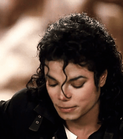 Man With Eyes Closed And Curly Hair GIF