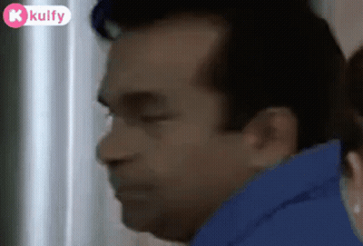 Man With Eyes Closed And Woman Behind Him GIF