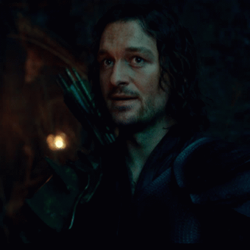 Man With Eyes Closed Holding Sword GIF