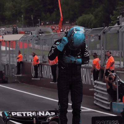 Man With Eyes Closed In AMG Petronas Shirt GIF
