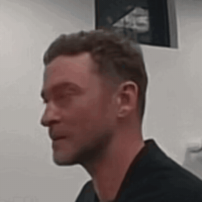 Man With Eyes Closed In Black Shirt GIF