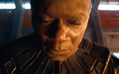 Man With Eyes Closed In Dark Room GIF