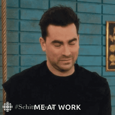 Man With Eyes Closed In Front Of Blue Brick Wall Saying Schit Me At Work GIF