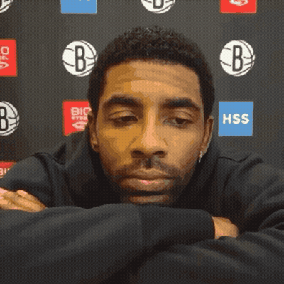 Man With Eyes Closed In Front Of HSS Sign GIF