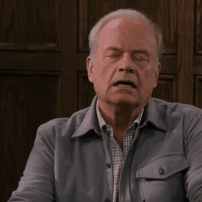 Man With Eyes Closed In Grey Jacket And Plaid Shirt GIF