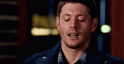 Man With Eyes Closed In Plaid Shirt And Blue Jacket GIF