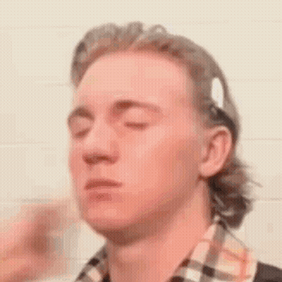 Man With Eyes Closed In Plaid Shirt And Headband GIF