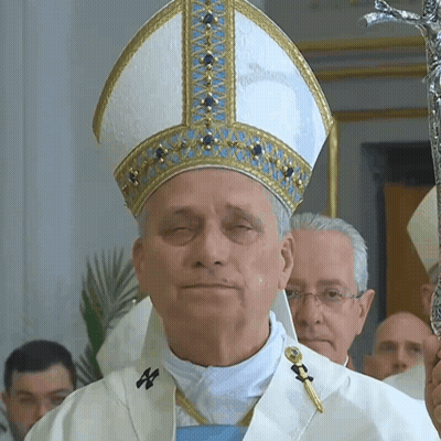 Man With Eyes Closed In White And Gold Hat GIF