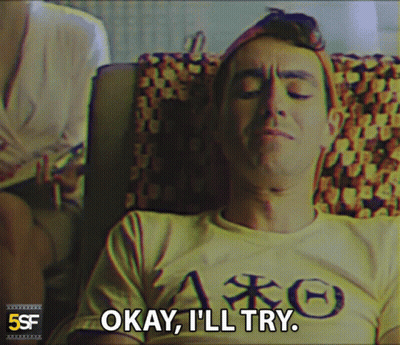 Man With Eyes Closed In Yellow Shirt Saying Okay I'll Try GIF