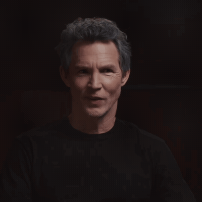 Man With Eyes Closed Looking At Camera GIF