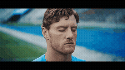 Man With Eyes Closed On Field GIF
