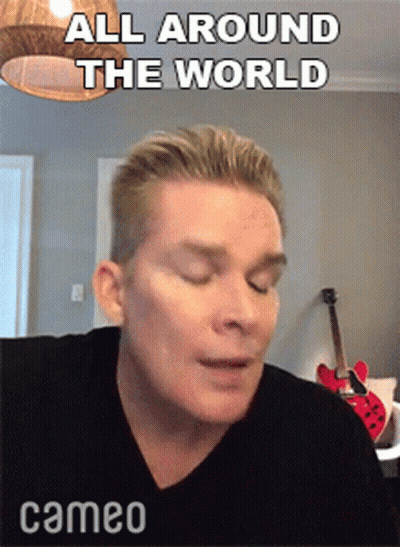 Man With Eyes Closed Saying All Around The World GIF