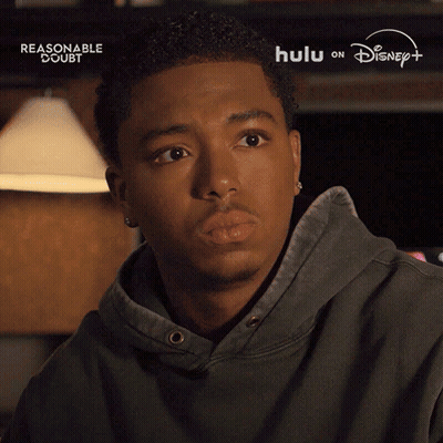 Man With Eyes Closed Says Alright in Front of Disney Logo