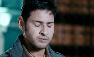 Man With Eyes Closed Wearing Jacket GIF