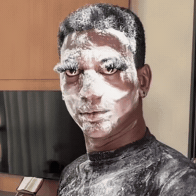 Man With Face Covered In White Powder GIF