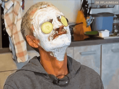 Man With Face Mask And Cucumber Slices Dr Pflaumisan GIF