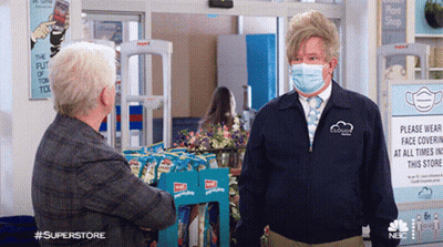Man With Face Mask Talking To Another Man GIF
