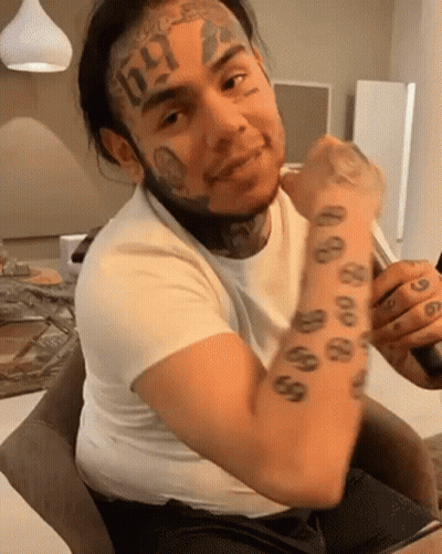 Man With Face Tattoo And 666 On Arm GIF