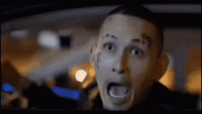 Man With Face Tattoo Driving Car Mouth Open GIF