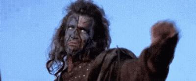Man With Face Tattoo Fist In Air Blue Sky GIF