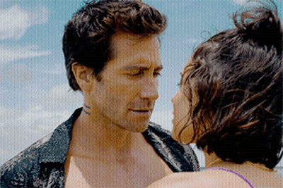 Man With Face Tattoo Looking At Woman GIF