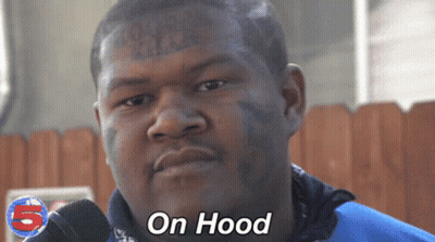 Man With Face Tattoo Saying On Hood At Microphone GIF