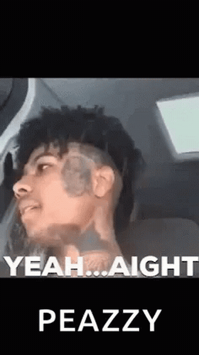 Man With Face Tattoo Sitting In Car Talking GIF
