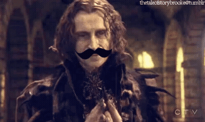 Man With Fake Mustache In Front Of CBS Logo GIF
