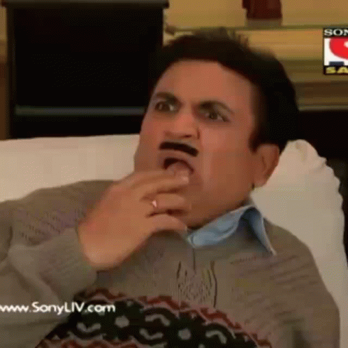 Man With Fake Mustache Sitting On Couch Eating GIF
