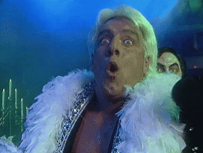 Man With Feathers Making Funny Face GIF
