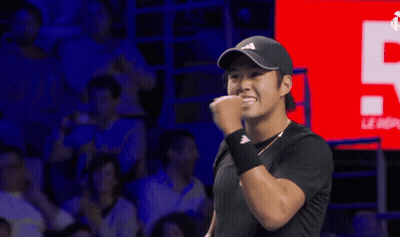 Man With Fist In Air Wearing Black Adidas Hat GIF
