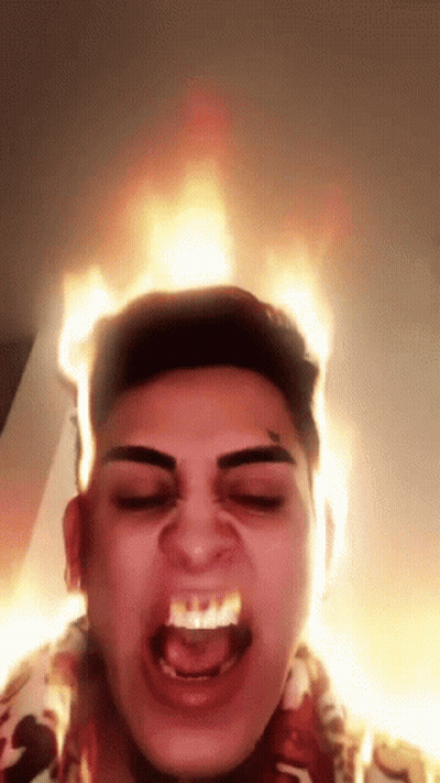 Man With Flames Coming Out Of Head Making Funny Face GIF