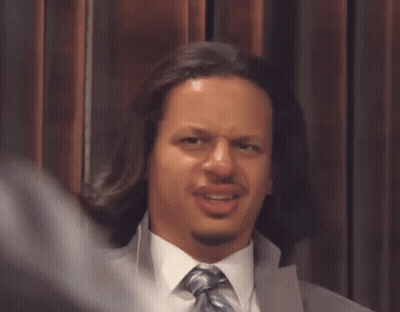 Man With Fork Funny Face At Man In White Suit GIF