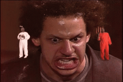 Man With Fork Funny Face At White-Suited Man GIF