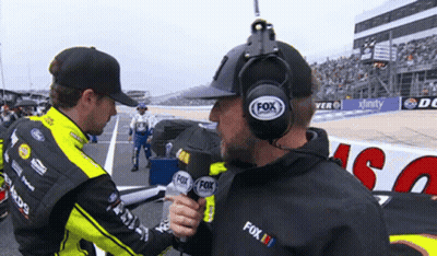 Man With Fox Radio Headset Talking to Another